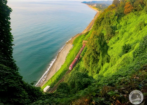 Train making its way along picturesque seaside in Svaneti, Georgia.  © Roman Stanek for Barents.pl Active Travel Agency